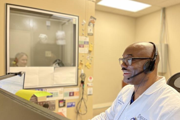 Audiologist Harlan Carroll giving a hearing test